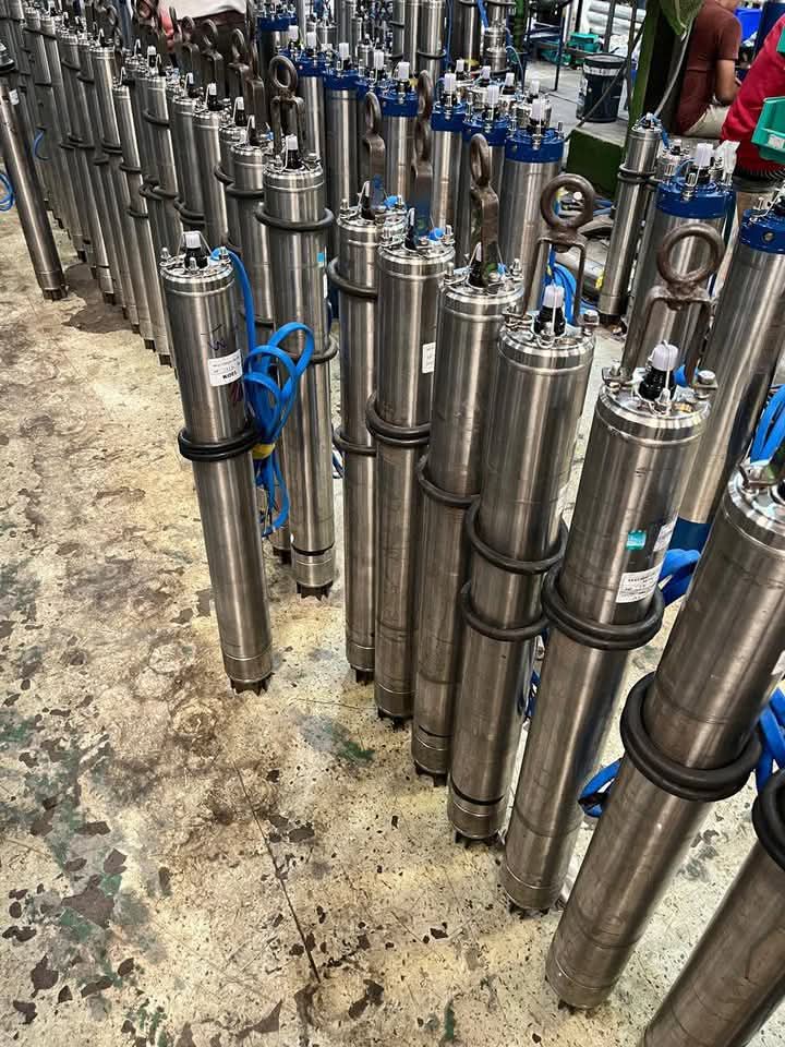 Technician checking a submersible pump.